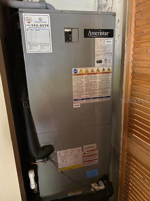 709 N Disston, Tavares, FL 32778 - utility room with heating unit