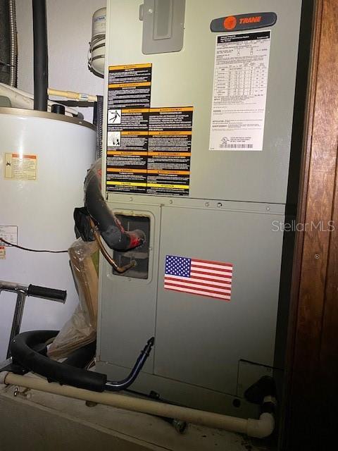 709 N Disston, Tavares, FL 32778 - utility room featuring heating unit