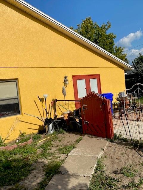 709 N Disston, Tavares, FL 32778 - property entrance featuring stucco siding and fence