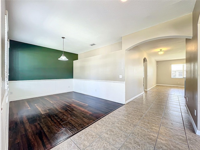 spare room with hardwood / wood-style flooring and a textured ceiling