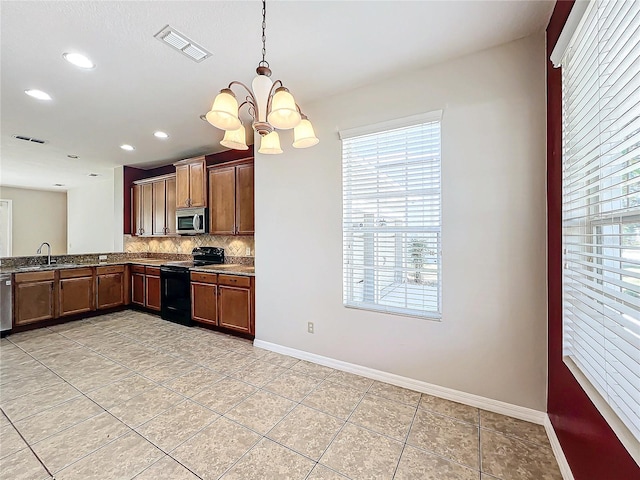 kitchen with stainless steel appliances, an inviting chandelier, tasteful backsplash, decorative light fixtures, and light tile patterned floors