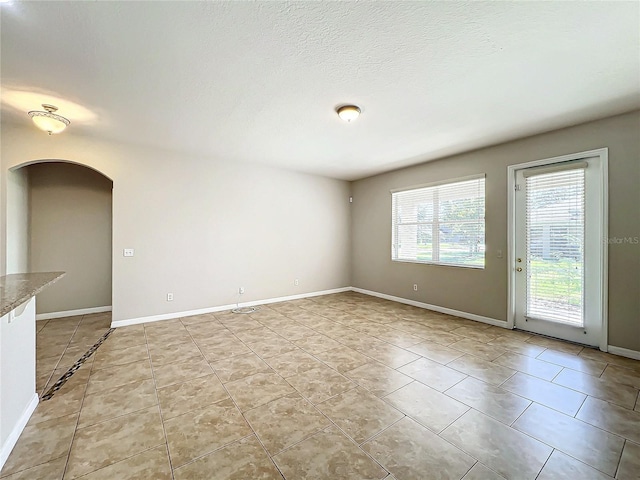 spare room featuring light tile patterned floors