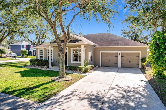 single story home featuring a garage and a front lawn