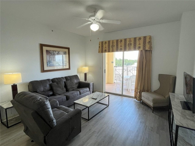 living area featuring ceiling fan and light wood-style flooring