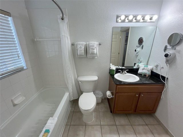 full bath with toilet, tile patterned flooring, shower / bath combo with shower curtain, and vanity