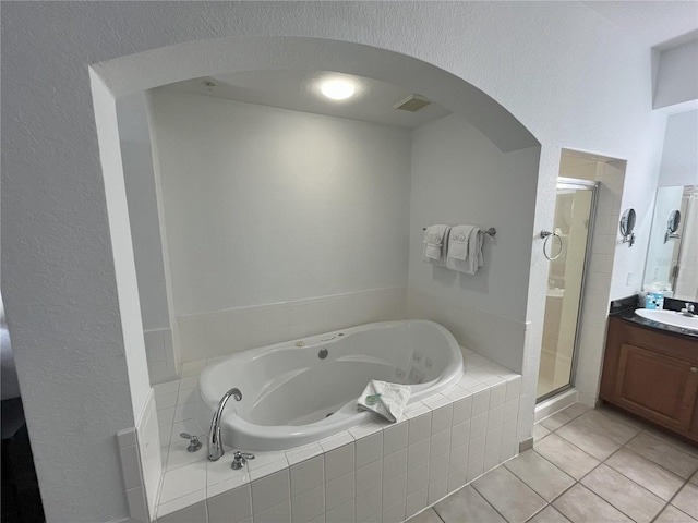 bathroom with visible vents, tile patterned floors, a whirlpool tub, vanity, and a shower stall