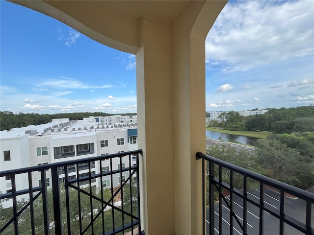 balcony featuring a water view