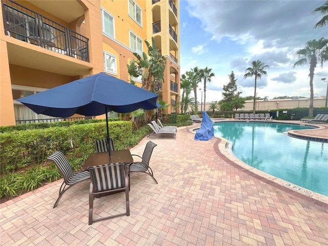 pool with a patio area