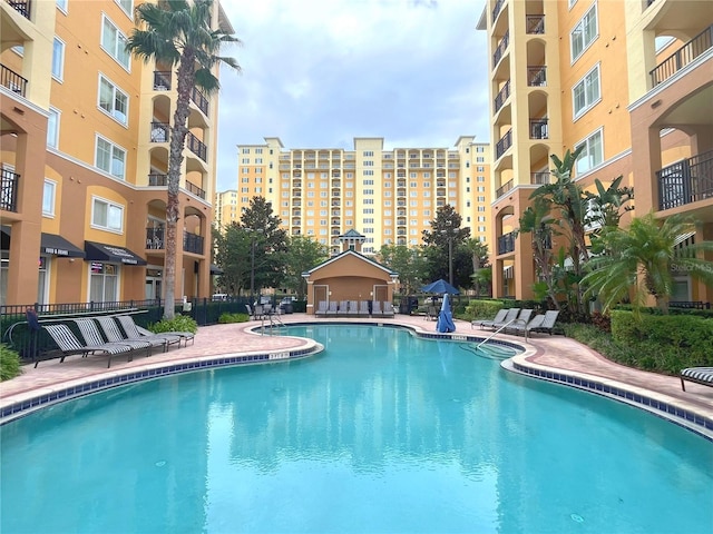 pool featuring a city view and a patio