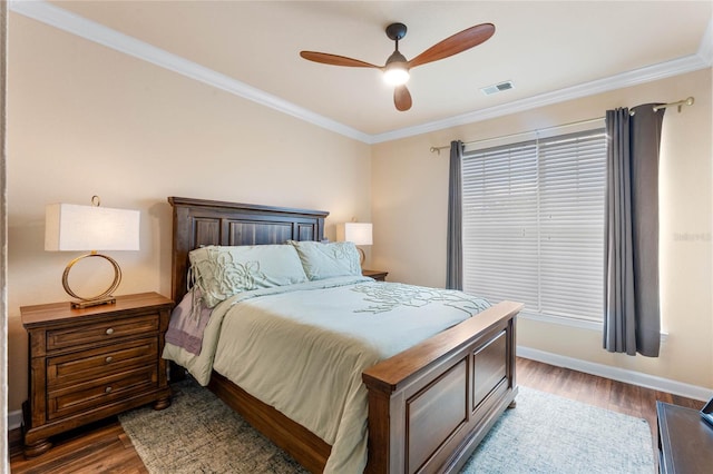 bedroom with ornamental molding, wood-type flooring, and ceiling fan