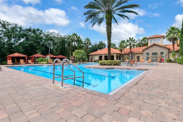 view of swimming pool with a patio