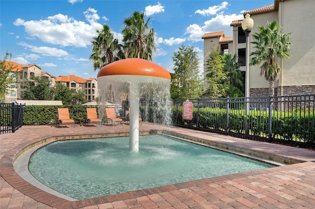 view of swimming pool featuring pool water feature