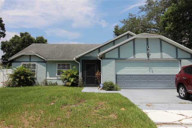 single story home featuring a garage and a front yard