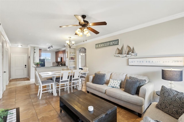 tiled living room with crown molding and ceiling fan with notable chandelier