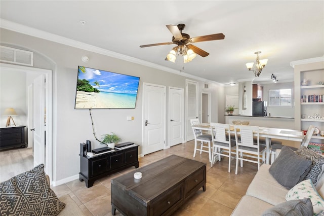 living area with light tile patterned floors, visible vents, ornamental molding, baseboards, and ceiling fan with notable chandelier