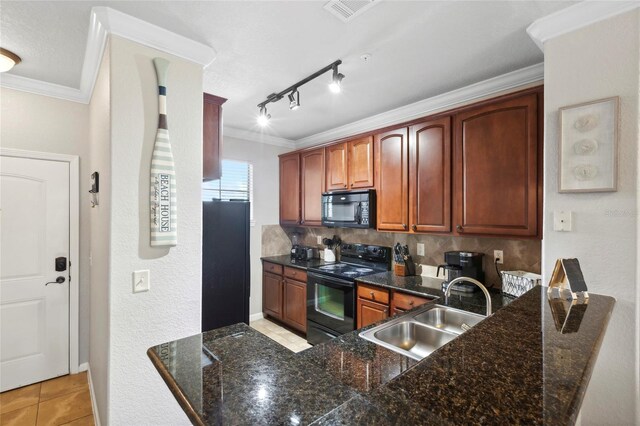 kitchen featuring light tile patterned floors, black appliances, ornamental molding, and a sink