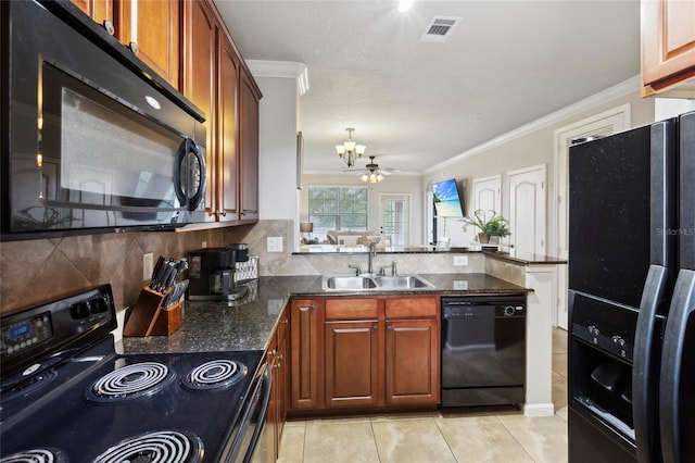 kitchen with backsplash, black appliances, ceiling fan with notable chandelier, and sink