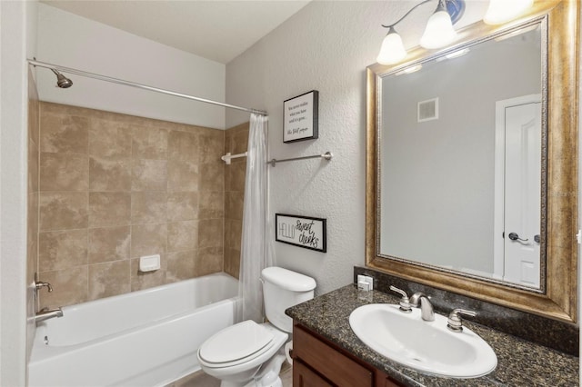 full bathroom with shower / tub combo, visible vents, a textured wall, toilet, and vanity