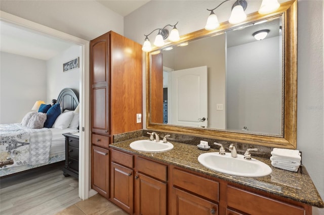 bathroom with hardwood / wood-style floors and dual bowl vanity