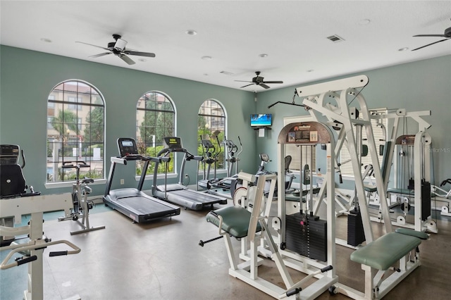 workout area featuring ceiling fan and visible vents