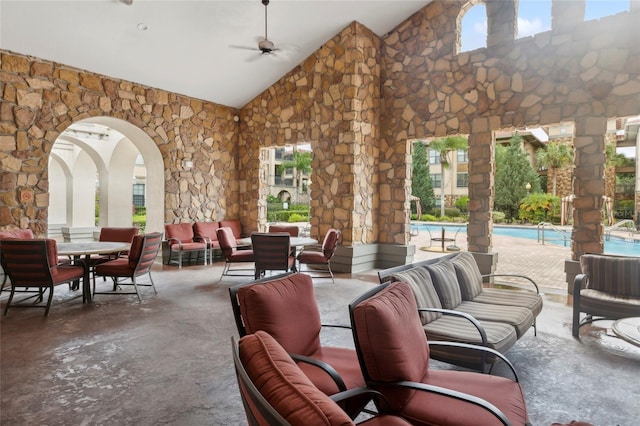 view of patio featuring an outdoor hangout area, a community pool, and ceiling fan