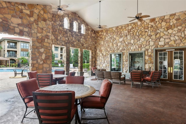 view of patio / terrace featuring ceiling fan and french doors