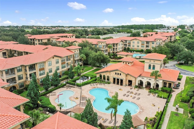 pool featuring a residential view and a patio