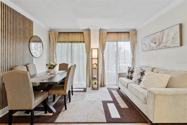 dining room featuring crown molding and a textured ceiling