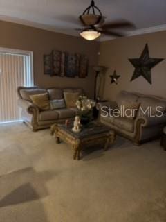 living room featuring carpet floors, crown molding, and ceiling fan