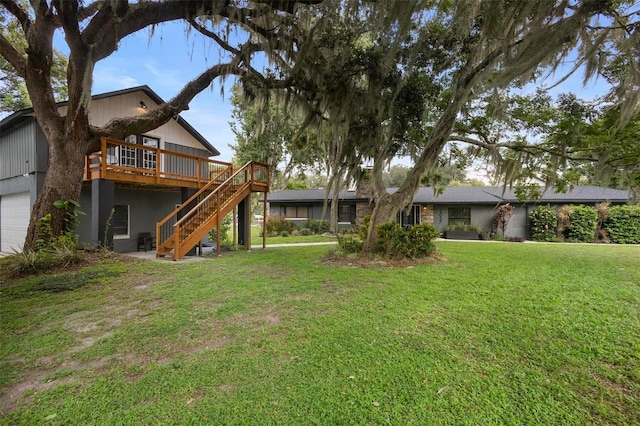 view of yard featuring a garage and a deck