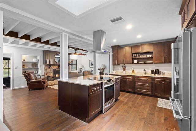 kitchen featuring appliances with stainless steel finishes, island range hood, dark hardwood / wood-style flooring, and ceiling fan