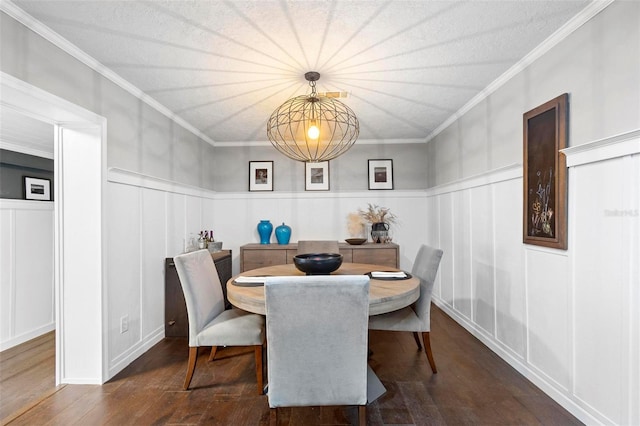 dining room featuring ornamental molding and hardwood / wood-style flooring