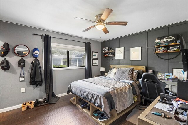 bedroom with ceiling fan and hardwood / wood-style flooring