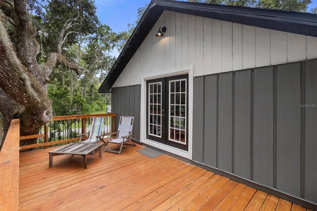 wooden deck featuring french doors