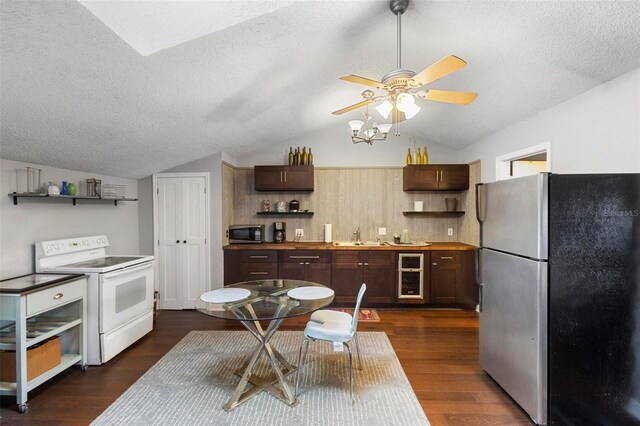 kitchen featuring appliances with stainless steel finishes, wine cooler, vaulted ceiling, and dark hardwood / wood-style floors