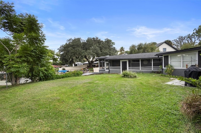 view of yard featuring a sunroom