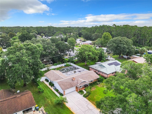 aerial view featuring a wooded view