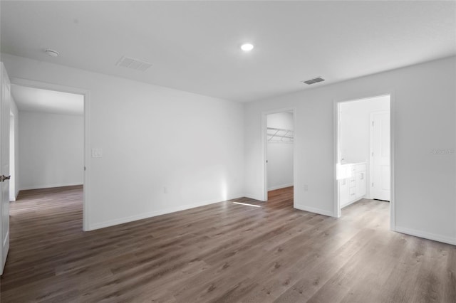 unfurnished room with dark hardwood / wood-style floors