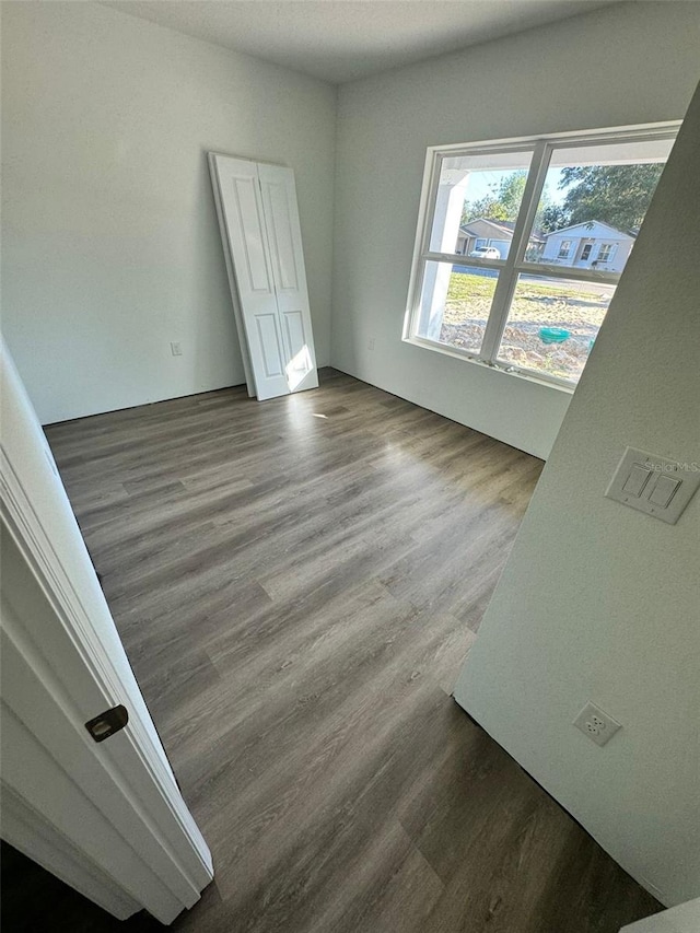 unfurnished room featuring hardwood / wood-style flooring