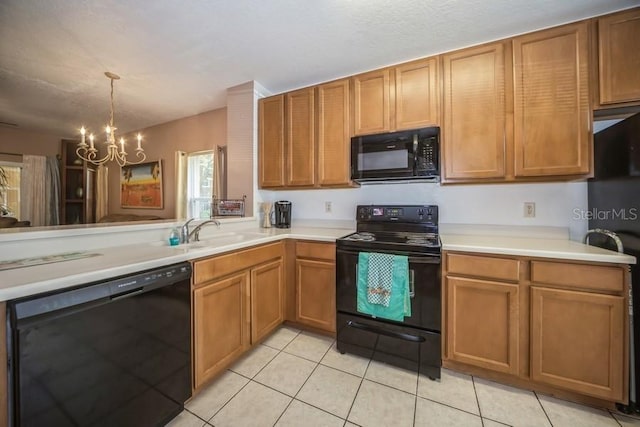 kitchen with an inviting chandelier, sink, black appliances, and light tile patterned floors