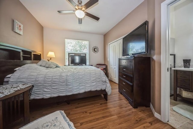 bedroom featuring wood-type flooring and ceiling fan