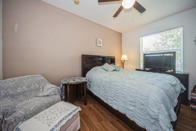 bedroom with ceiling fan and wood-type flooring