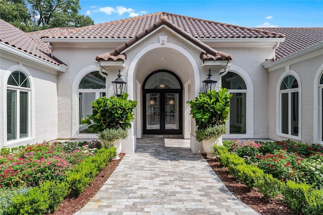 entrance to property featuring french doors