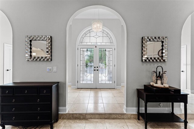 tiled entrance foyer featuring french doors