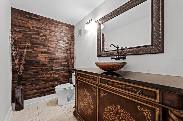 bathroom with vanity, tile patterned floors, and toilet