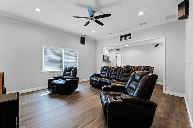 living room with dark hardwood / wood-style flooring, ornamental molding, and ceiling fan