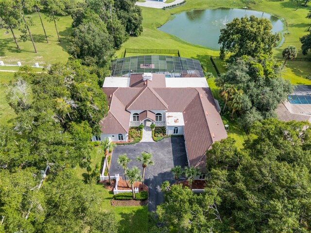 birds eye view of property with a water view