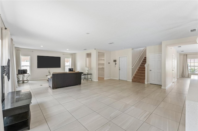 living room with light tile patterned floors