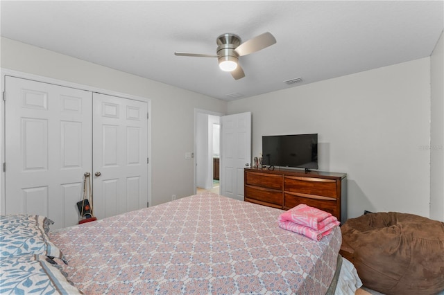 carpeted bedroom featuring a closet and ceiling fan