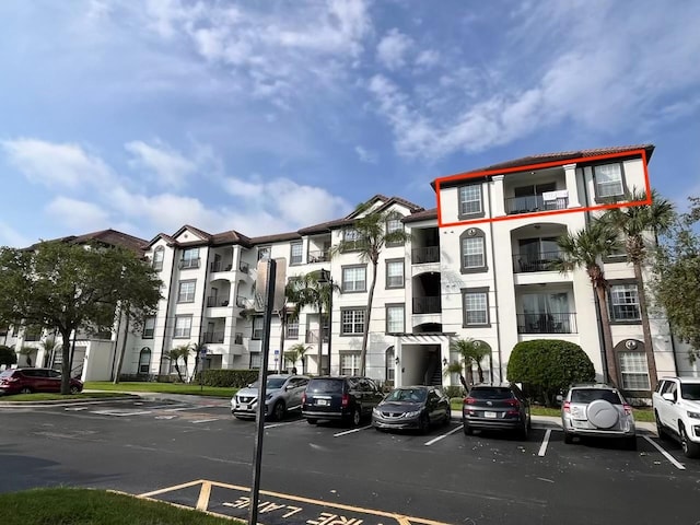 4114 Breakview Dr Unit 406, Orlando, FL 32819 - view of property featuring uncovered parking